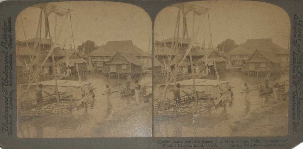 Quaint, straw-thatched houses of a Moro village, Philippine section of the World’s Fair, St. Louis, U.S.A.